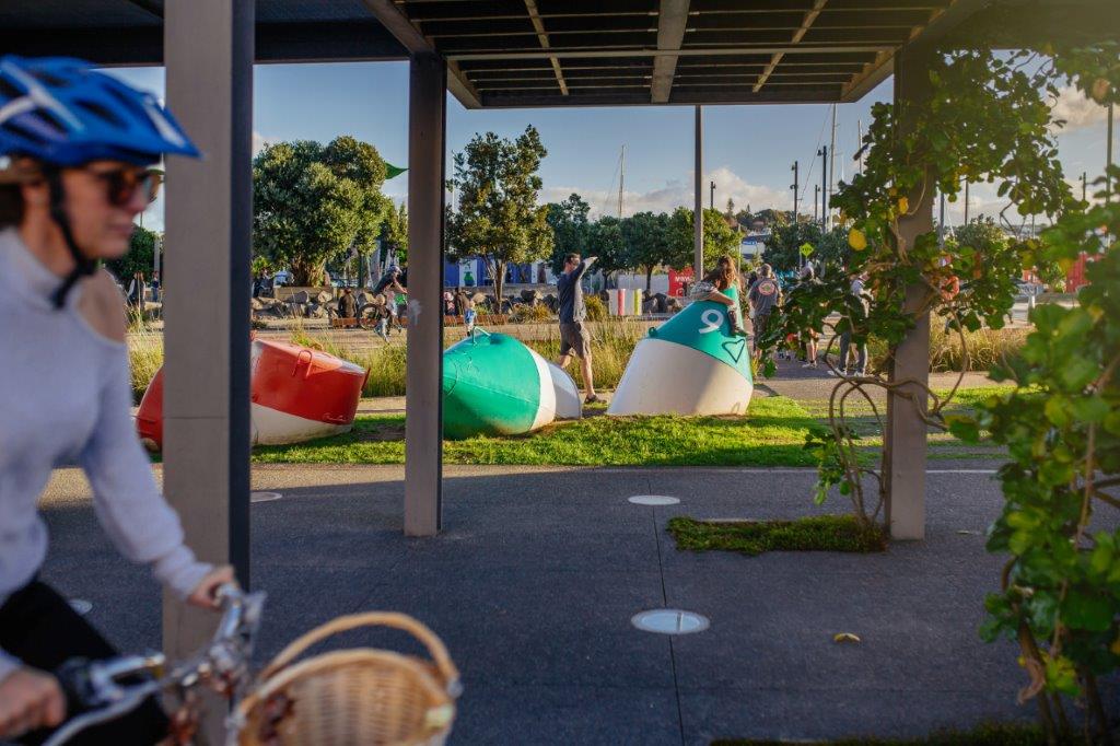 Cycling in Wynyard Quarter, view of Silo Park and art installations in the park