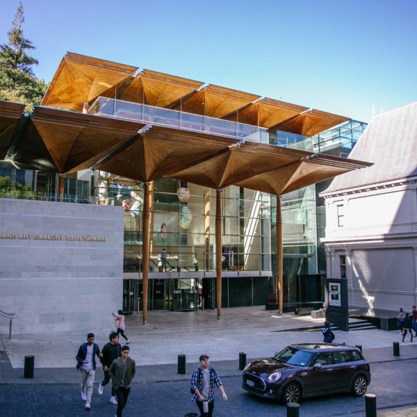 Auckland Art Gallery in the city centre with people and cars on Kitchener Street in foreground. Image: Sacha Stejko.