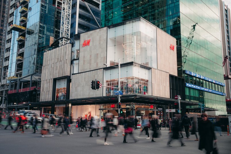 People crossing the intersection of Queen and Customs Street in front of H&M Commercial Bay. Image: Logan West, supplied by H&M