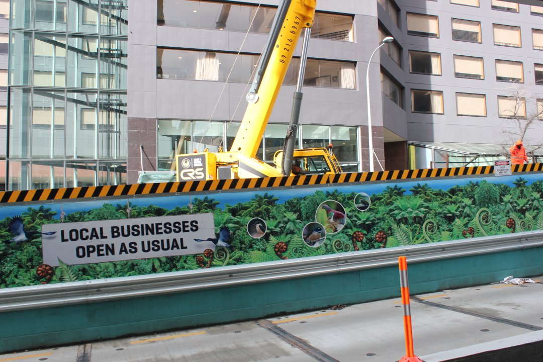 City Rail Link 'businesses open as usual' hoardings on Albert Street, August 2018. Image: Heart of the City